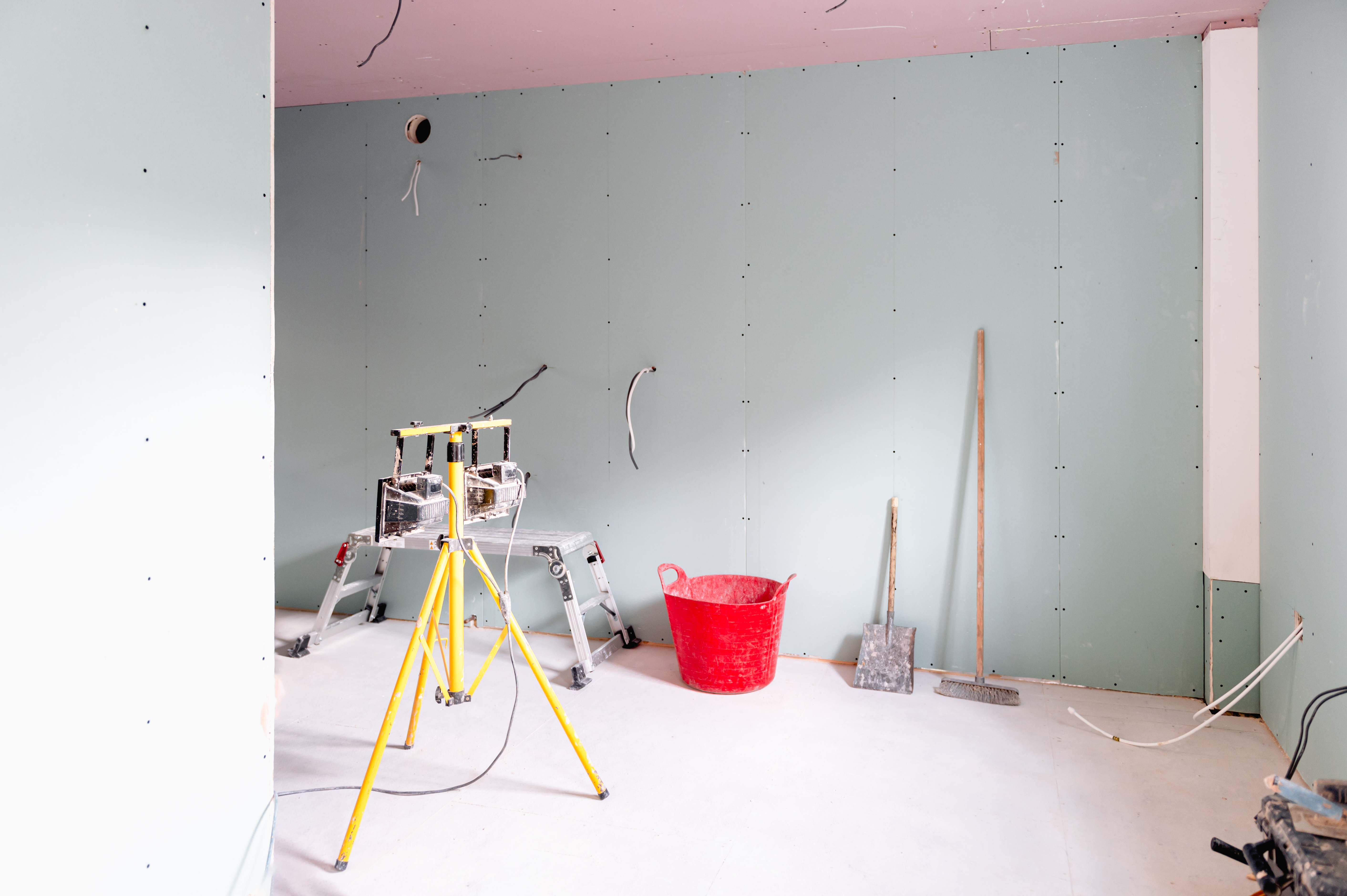 Freshly Plastered Walls in Room, big renovation project. Drying out of plastered internal walls. Using Sound Plasterboards for restricts the acoustic flow within house